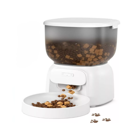 Golden retriever eating from a white automatic smart pet feeder with timer and portion control