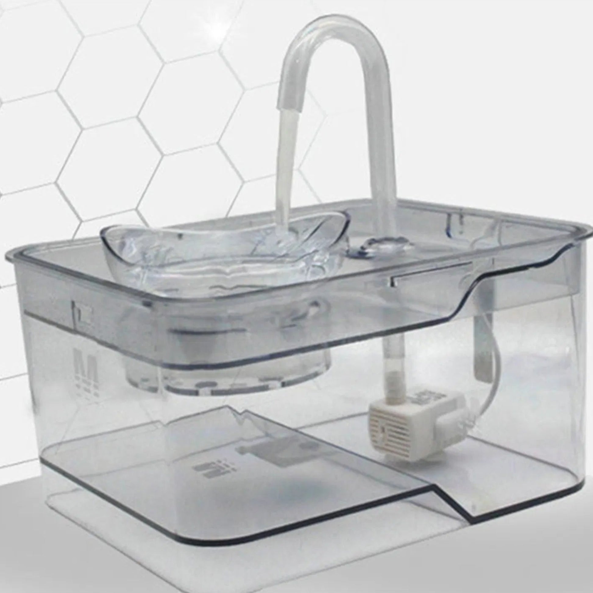 Gray tabby cat drinking from a smart pet water fountain with continuous fresh water flow