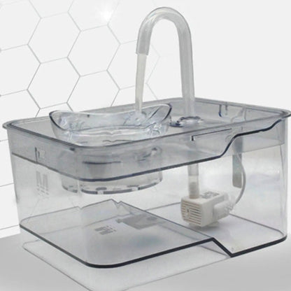 Gray tabby cat drinking from a smart pet water fountain with continuous fresh water flow